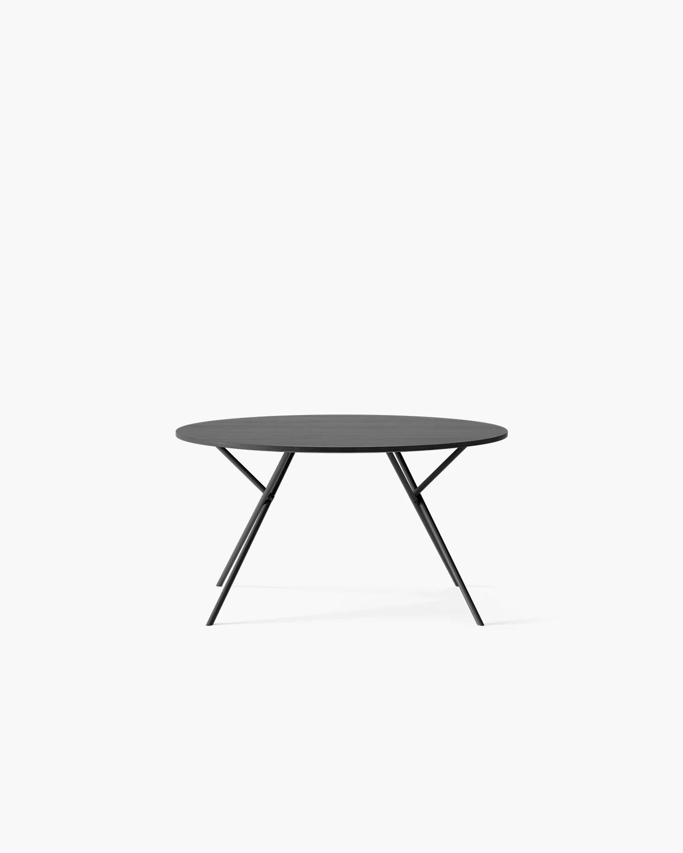 Luna Dining Table in black oak, featuring a modern round design with elegant, striking black legs.